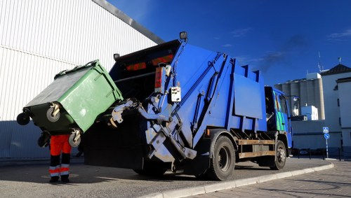 Professional team clearing a cluttered garage in Finsbury Park