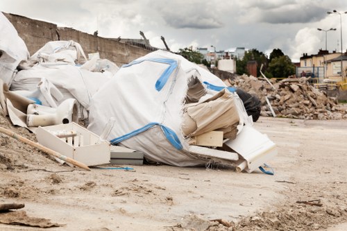 Construction site with waste removal in progress in Finsbury Park