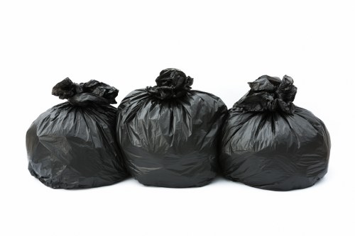 Team managing builders waste removal with professional equipment